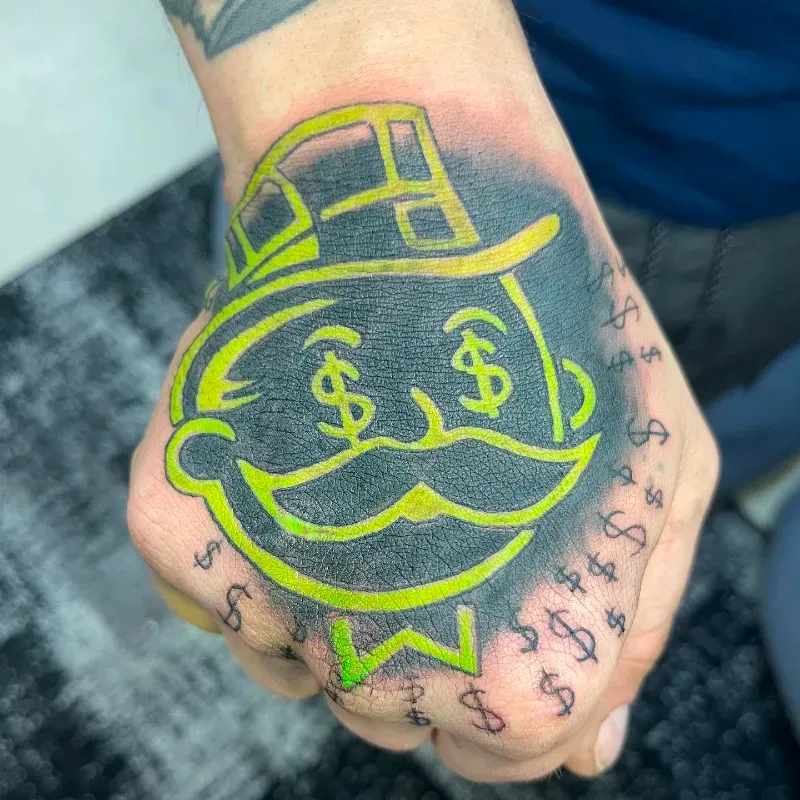 monopoly man branded tattoo